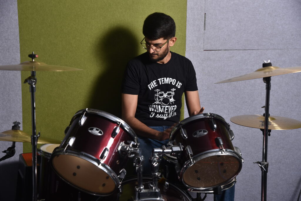 Sagar Belsare playing drum kit in Pune studio during live performance session