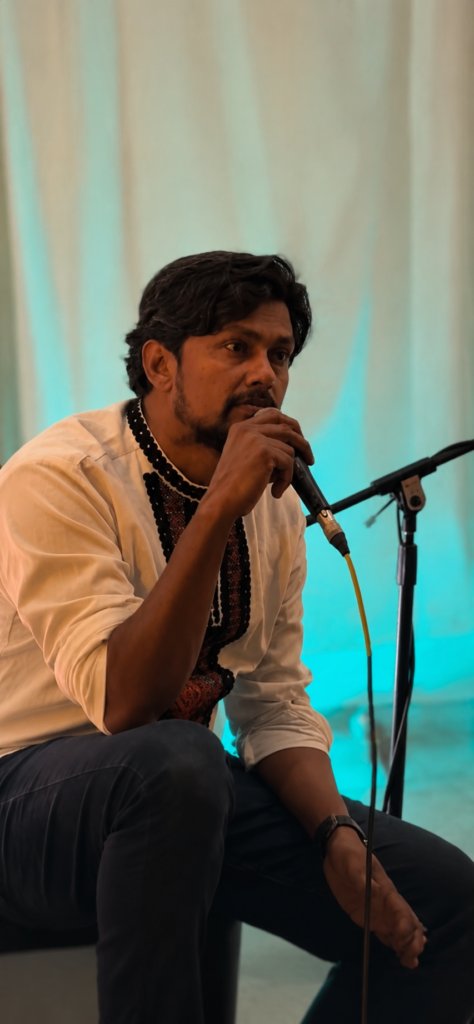 Poet performing spoken word poetry during an intimate live event in Pune