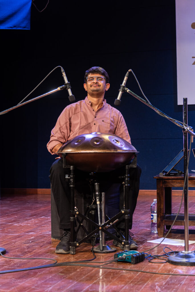 Sagar Belsare playing the handpan during a live performance in Pune