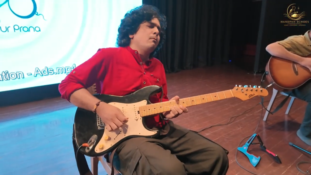 Pune guitarist playing electric guitar