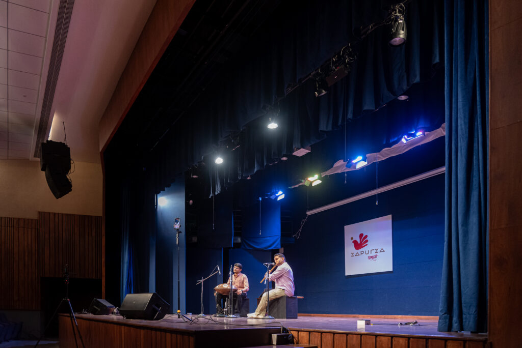 Zapurza auditorium hosting a live instrumental music performance in Pune