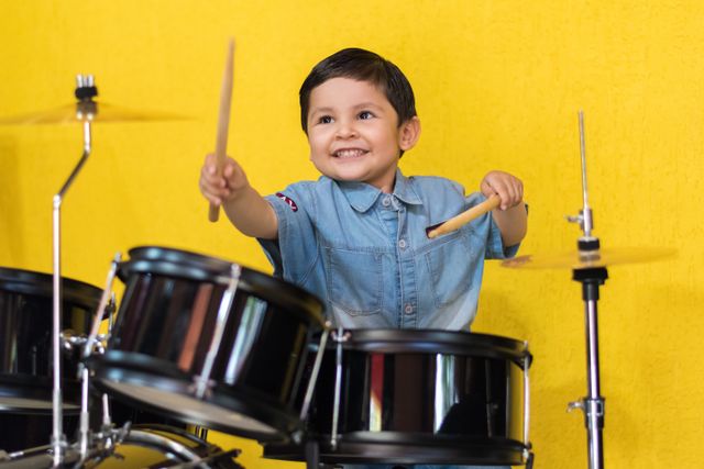 A child appearing for drums exams in Pune during a home tuition class