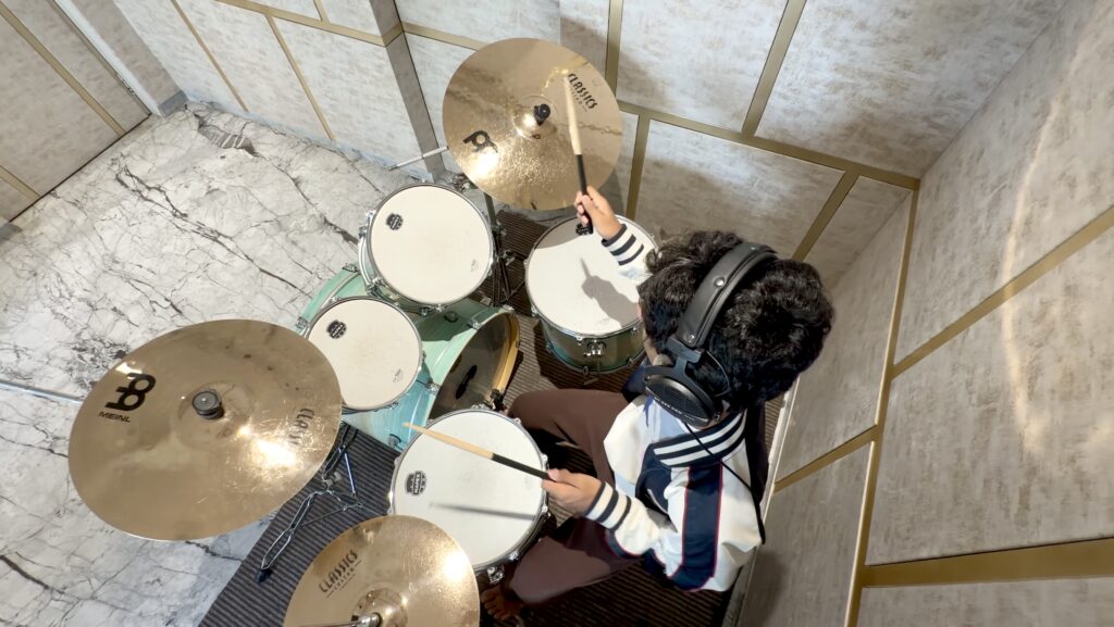 Student learning drums during a one-to-one home drum tuition session in Pune with The Rhythm Story